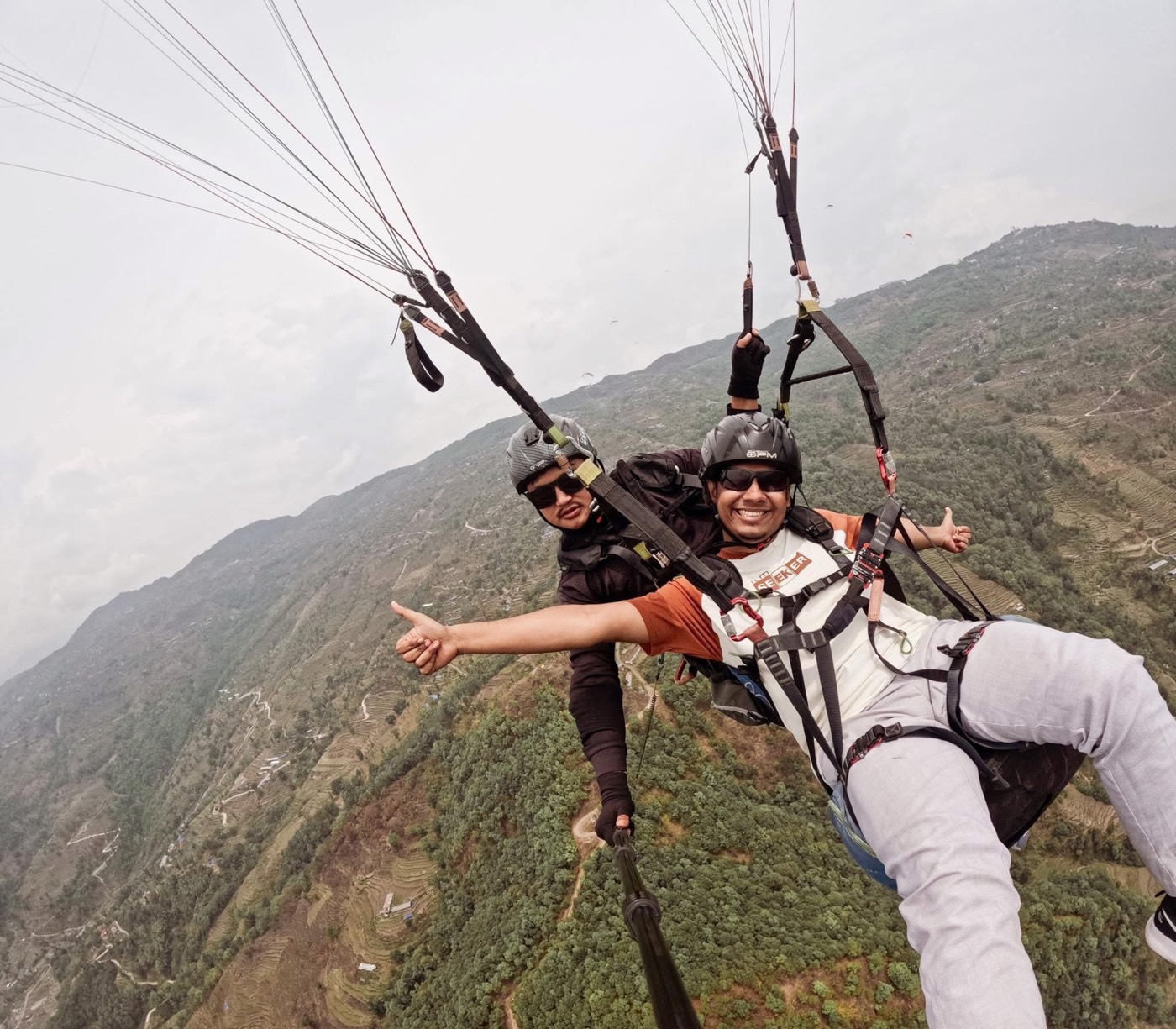 Paragliding over a mountain landscape